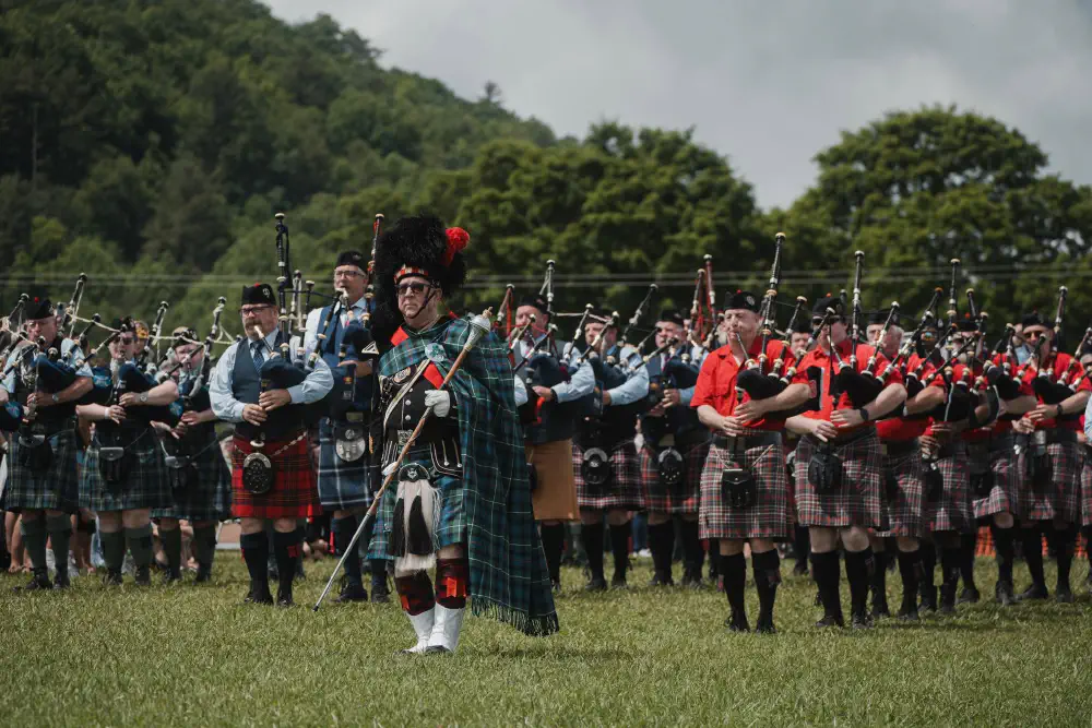 Massed pipers performing outdoors at the Smoky Mountain Scottish Festival and Games